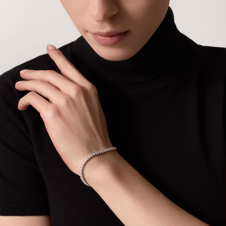 tennis bracelet featuring a row of round-cut diamonds