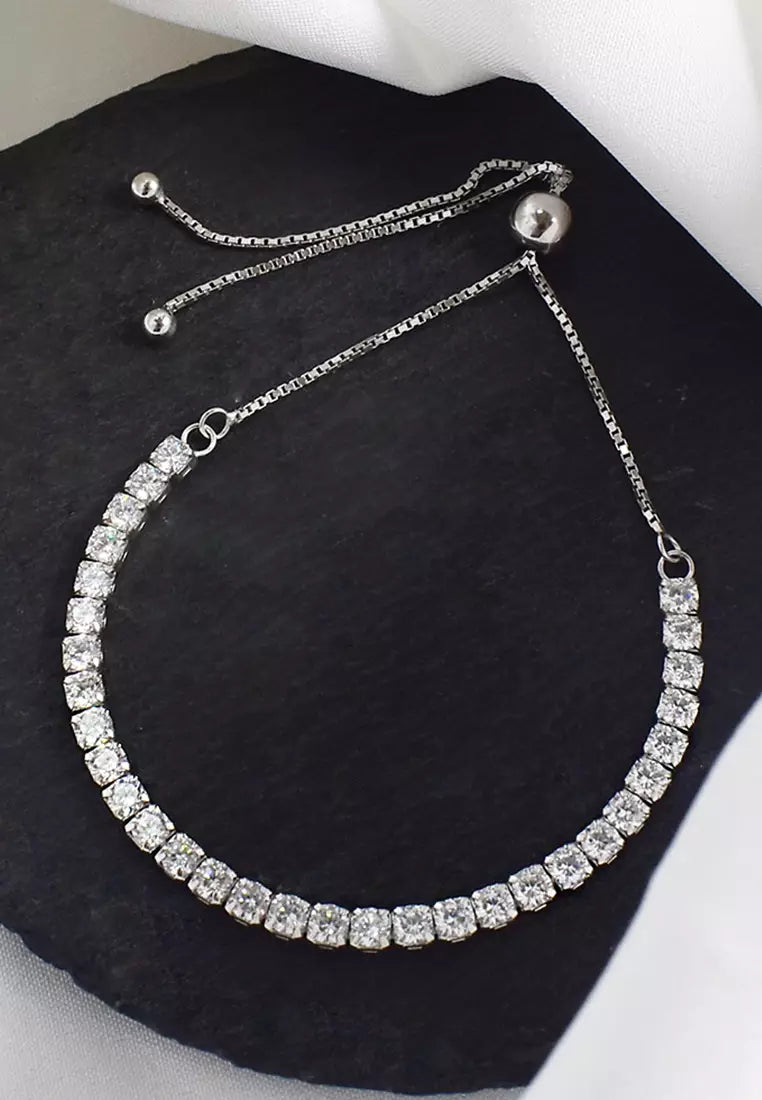 tennis bracelet featuring a row of round-cut diamonds